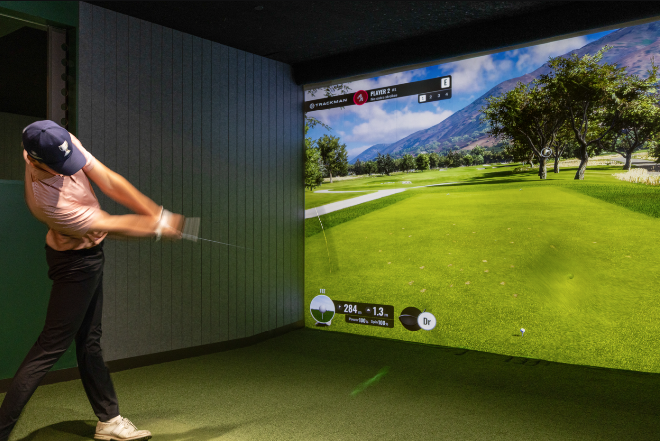 Golfer driving off the tee.